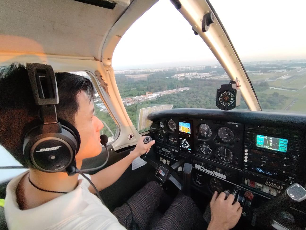 Ray at the controls of a light aircraft