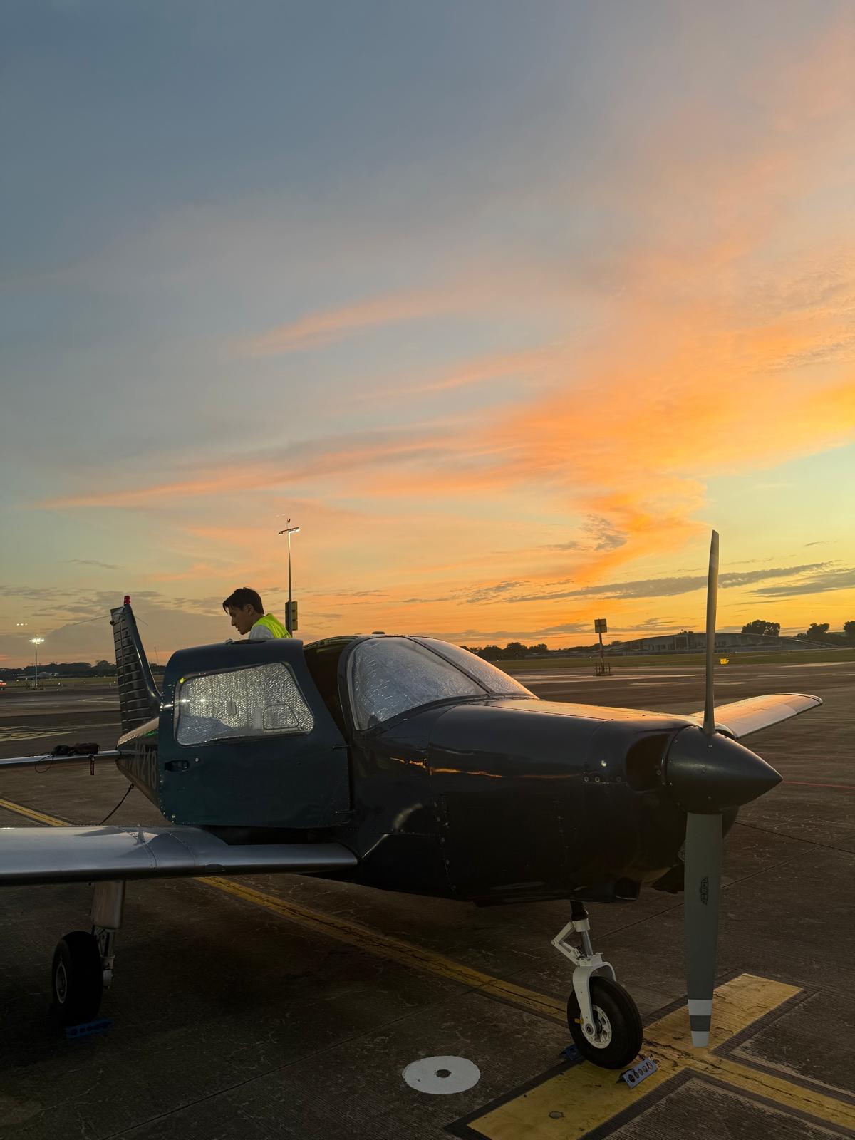 Ray preparing his aircraft at sunset